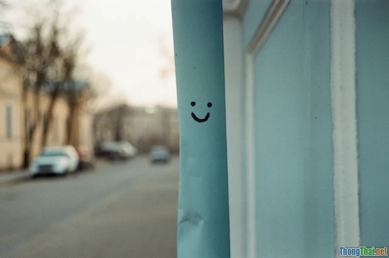 feeling trapped, suppressed emotion, sad smile