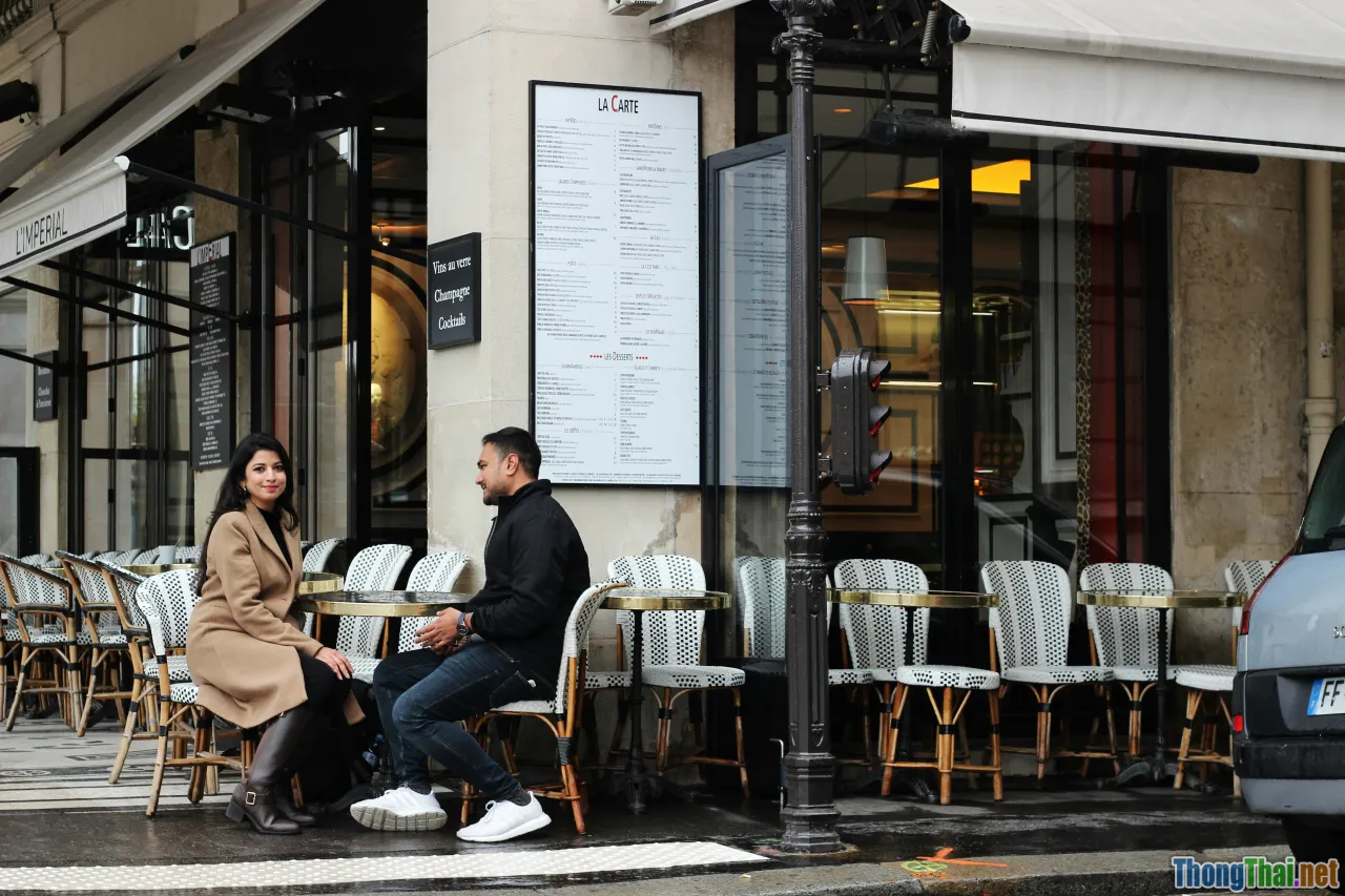 itinerary, couple planning, cafe window, rainy streets