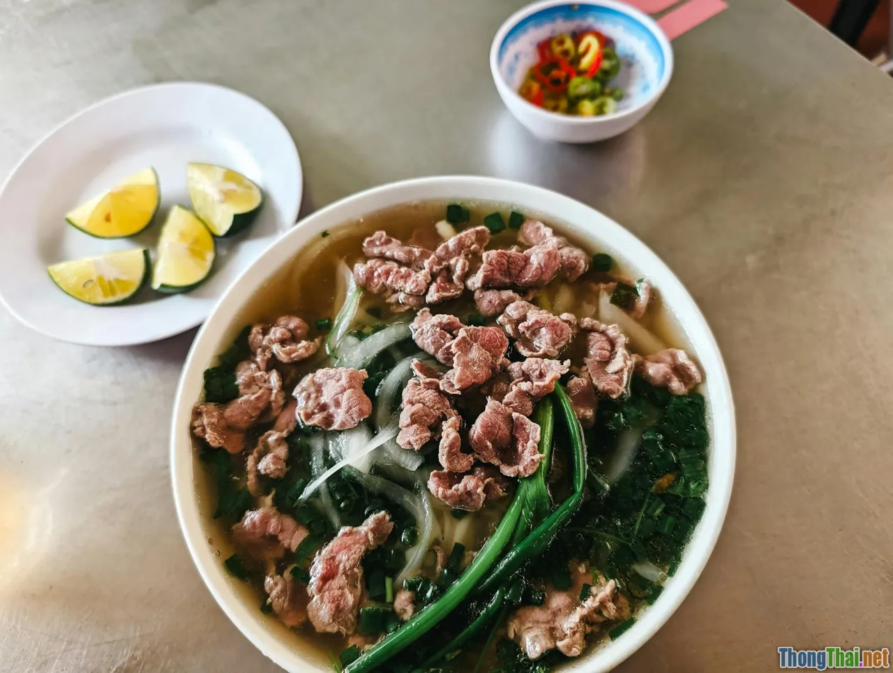 beef pho bowl, broth Steam, tenderness, Hanoi style
