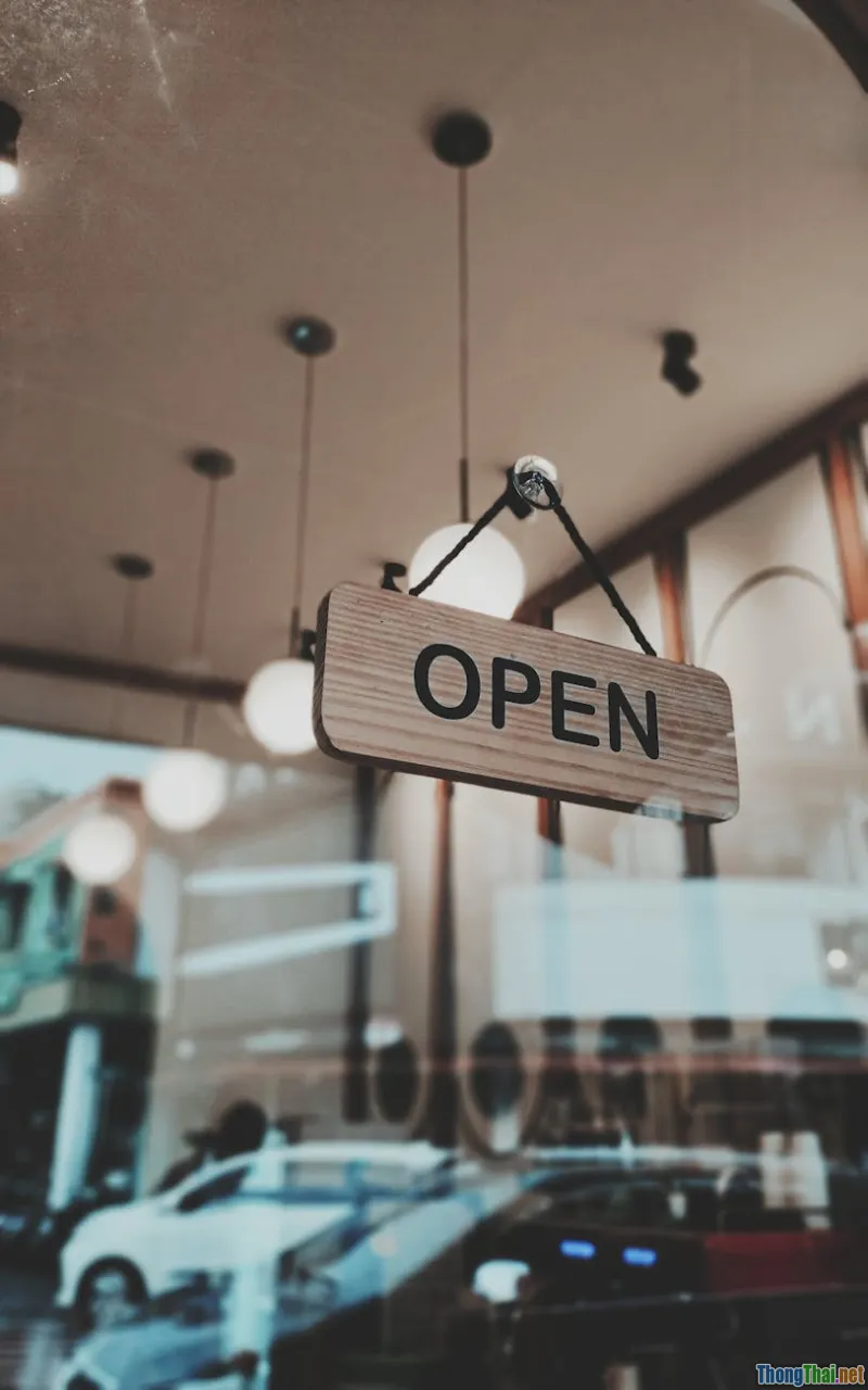 cafe window, raindrops, latte art, warm lights