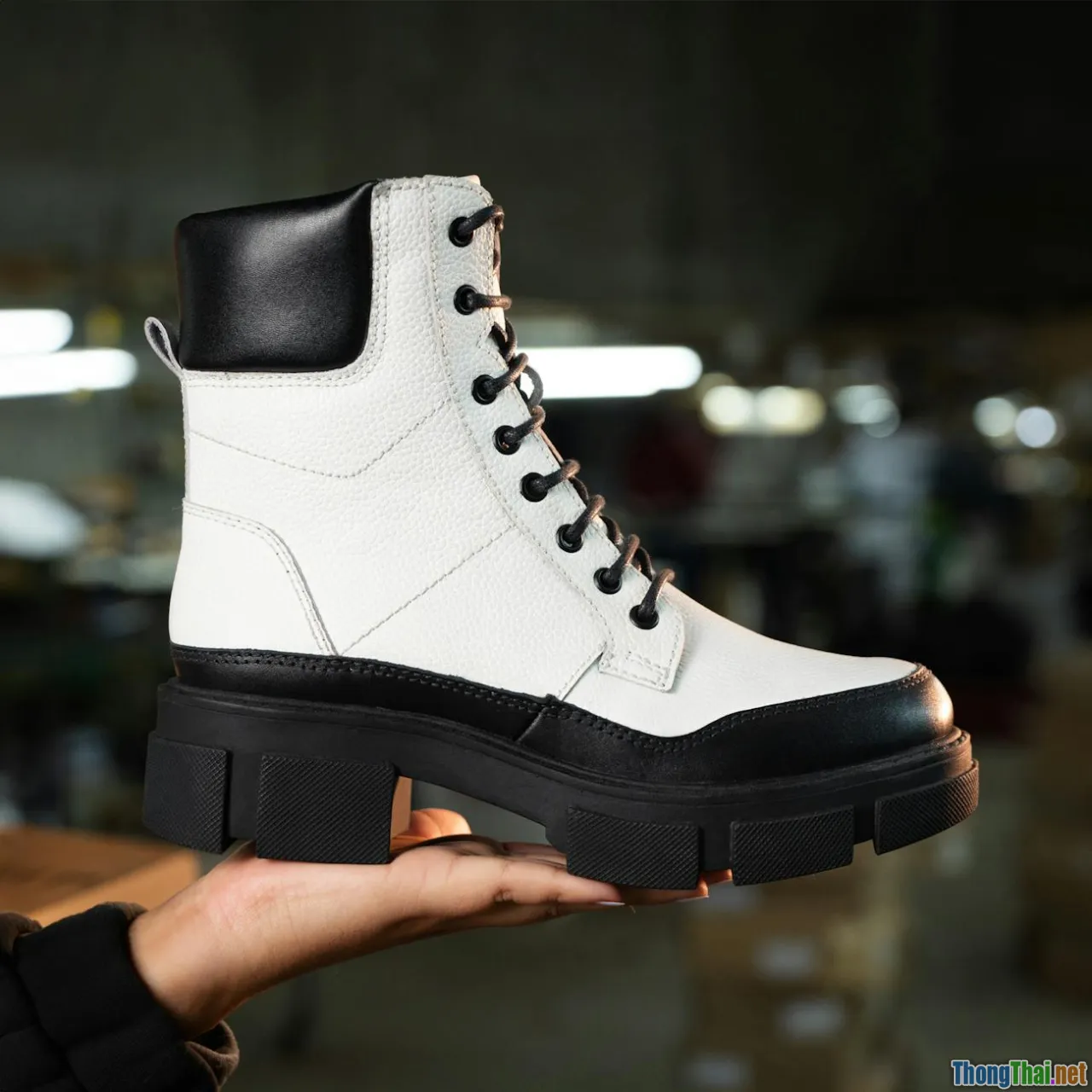 leather texture, shoe material, close-up, hand holding shoe