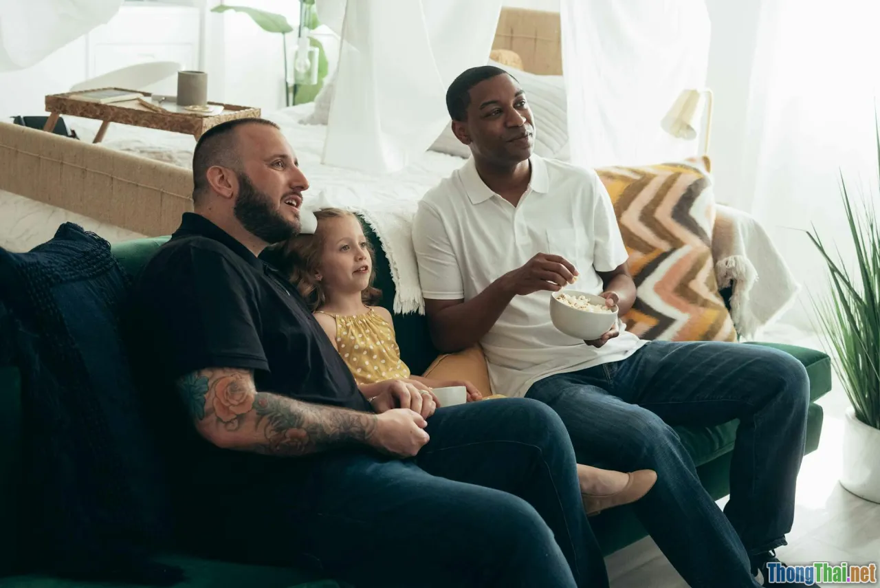 smiling family, popcorn, togetherness, tv stand
