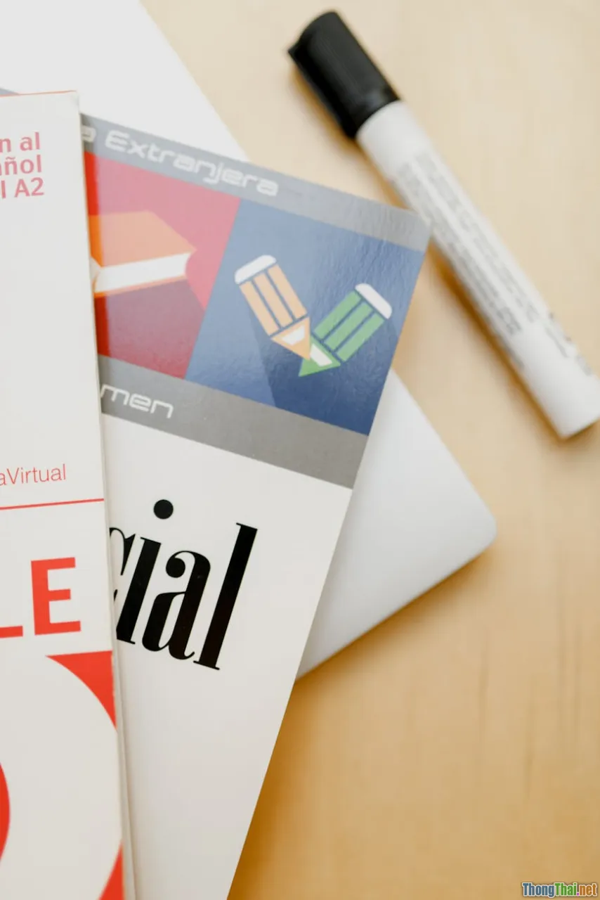 vocabulary book, grammar notes, confused student